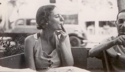 Women smoking at a table in a café